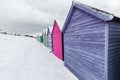 Beach huts in winter snow on coast of Herne Bay, Kent, England Royalty Free Stock Photo