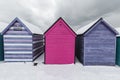 Beach huts in winter snow on coast of Herne Bay, Kent, England Royalty Free Stock Photo