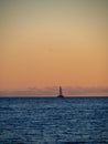 Beach in the Ibiza island with sailboat in the water during sunset. Royalty Free Stock Photo