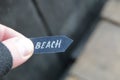 Beach idea. A hand holds a pointer with the inscription beach Royalty Free Stock Photo