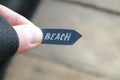 Beach idea. A hand holds a pointer with the inscription beach Royalty Free Stock Photo