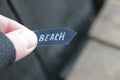 Beach idea. A hand holds a pointer with the inscription beach Royalty Free Stock Photo