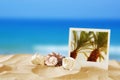 Beach with instant photo in front of sea background Royalty Free Stock Photo