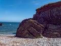 A beach on the Irish coast of the Atlantic Ocean on a sunny day. Picturesque rocky coast. Seascape, rock formation on sea shore Royalty Free Stock Photo