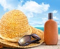 Beach items and suntan lotion at the beach Royalty Free Stock Photo