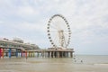 Beach and jetty with ferris wheel of Scheveningen Royalty Free Stock Photo