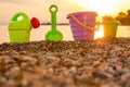 Beach kid`s toys on pebble. Tourism background. Travel with children. Summer vacation concept. Toys on beach. Kids toys Royalty Free Stock Photo