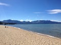 Beach Lake tahoe boat waterfront beach sandy sand water mountains blue