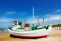 Beach, land and fishing boat on sand outdoor in nature by sea for travel in summer. Ship, transport and vessel on Royalty Free Stock Photo