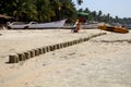 Column of figures of sand on the ocean India Goa