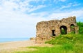 Beach landscape with ruins of castle Royalty Free Stock Photo