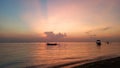 Early morning glow with romantic sunrise sky color scenery over the sea. Sanur Beach, Bali, Indonesia Royalty Free Stock Photo