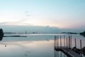 Beach landscape view with wooden foot bridge during sunset. Beatiful screnery of a beach with ocean and sky and water reflection Royalty Free Stock Photo