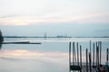 Beach landscape view with wooden foot bridge during sunset. Beatiful screnery of a beach with ocean and sky and water reflection Royalty Free Stock Photo