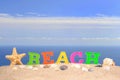 Beach letters on a beach sand