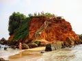 Beach life at Mirissa Sri Lanka featuring vacationers enjoying themselves in the water.