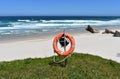 Beach with life saver, white sand and wild sea with waves on a sunny day. Viveiro, Lugo, Galicia, Spain. Royalty Free Stock Photo
