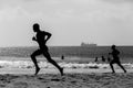 Beach Lifeguards Running Silhouetted Royalty Free Stock Photo