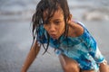 Beach lifestyle portrait of young beautiful and happy 7 or 8 years old Asian American mixed child girl with wet hair enjoying Royalty Free Stock Photo