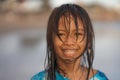 Beach lifestyle portrait of young beautiful and happy 7 or 8 years old Asian American mixed child girl with wet hair enjoying Royalty Free Stock Photo