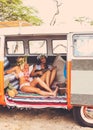 Beach Lifestyle Surfer Girls in Vintage Surf Van Royalty Free Stock Photo