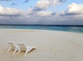 Beach Lounge Chairs On A Beautiful Tropical Sand Beach With Cloudy Blue Sky. Maldives