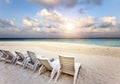 Beach Lounge Chairs On A Beautiful Tropical Sand Beach With Cloudy Blue Sky. Maldives
