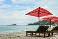 Beach lounge chairs with umbrella on the White Sand beach Royalty Free Stock Photo