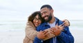 Beach, love and happy couple hug, smile and travel together on marriage partner vacation, holiday or outdoor wellness Royalty Free Stock Photo