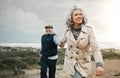 Beach, love and senior couple holding hands on romantic evening walk in nature on happy date. Smile, romance and Royalty Free Stock Photo