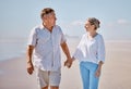 Beach, love and senior couple holding hands while walking for health, exercise and wellness. Happy, romance and elderly Royalty Free Stock Photo