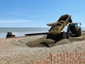 Beach maintenance at Eastbourne, East Sussex, UK.