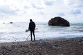Beach and man with metal detector. Travel photo 2018, december Royalty Free Stock Photo