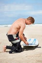 Beach, man and surfboard leash for exercise, fitness and workout outdoor in summer . Surfer, wetsuit and person with