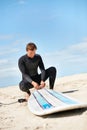Beach, man and surfboard rope outdoor in summer for exercise, fitness and workout. Surfer, wetsuit and person with leash