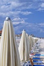 Beach of marotta in the italian region of marche during summer with parasols and clouds