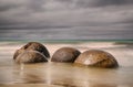 Beach with Moeraki Boulders, New Zealand - long time exposure Royalty Free Stock Photo