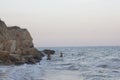 Beach morning sea blue rocks over water dawn Royalty Free Stock Photo