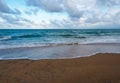 the beach in the morning with soft blue wave and sugar sand, cloudy sky Royalty Free Stock Photo