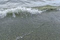 Waves on the beach, sand and water in the beach, stone on the beach Royalty Free Stock Photo