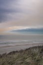 Beach near Domburg town in spring fresh morning with cloudy sky