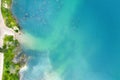 Beach near the forest with clear blue water