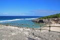 A beach nearby the famous Trou dArgent at Rodrigues Island taken from top with visible safety wooden barrier Royalty Free Stock Photo
