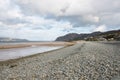 Beach in North Wales with many rocks and pebbles on it Royalty Free Stock Photo