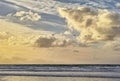 Beach, ocean and blue sky with line of birds, clouds and water on shoreline with sunshine. Waves, sunrise and dawn in Royalty Free Stock Photo