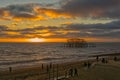 Beach and old pier in sunset, Brighton, England Royalty Free Stock Photo