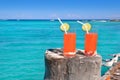 Beach orange cocktail in Caribbean turquoise sea