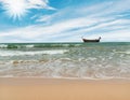 Beach with over sunlight and fishing boat