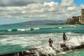 The beach on the Pacific Ocean in Hawaii USA, August 2012 , people standing a pier