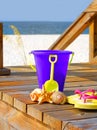 Beach pail on boardwalk Royalty Free Stock Photo